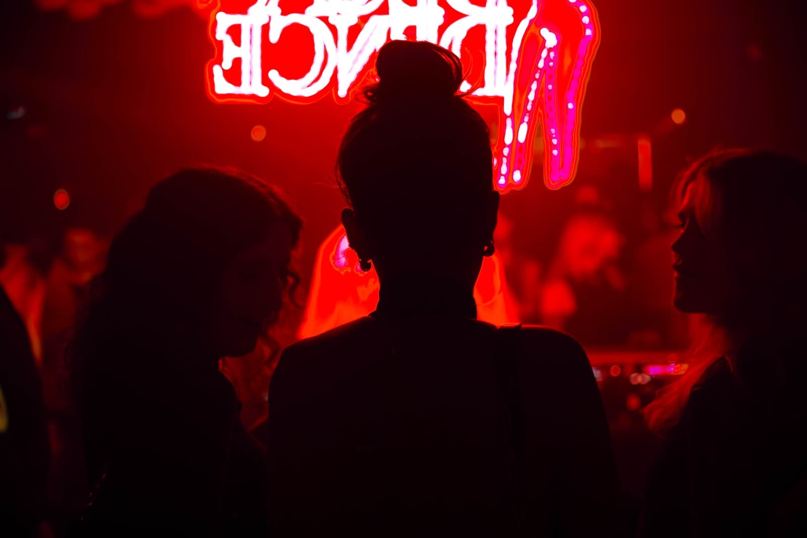 Intimate low-lit Chelsea nightclub interior with table seating and warm lighting