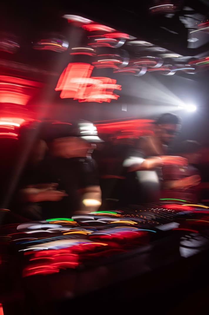 Dimly lit interior of an exclusive London nightclub with guests enjoying the evening