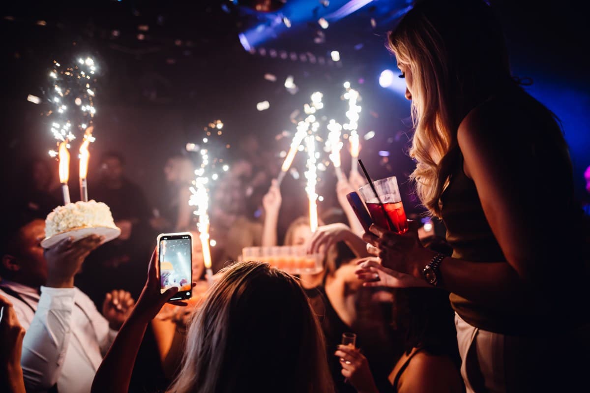Stylishly dressed group arriving at a UK nightclub entrance