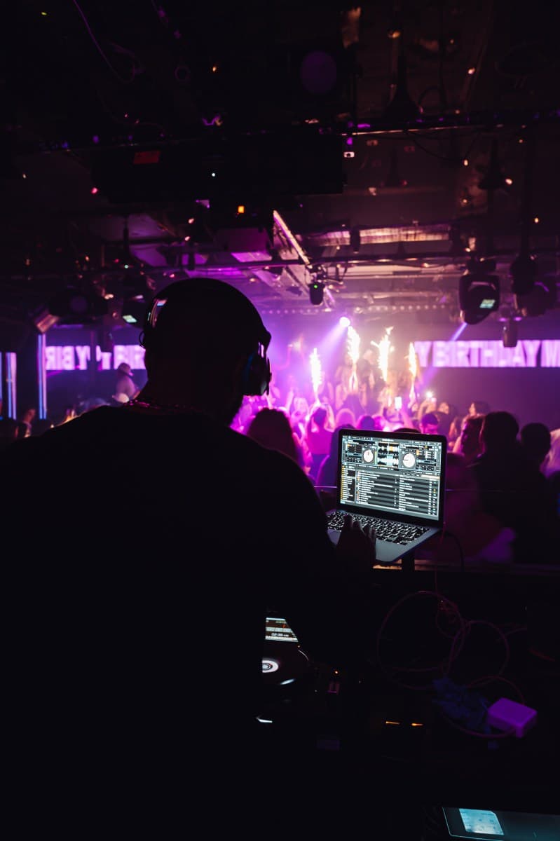 London R&B nightclub with energetic crowd and DJ setup