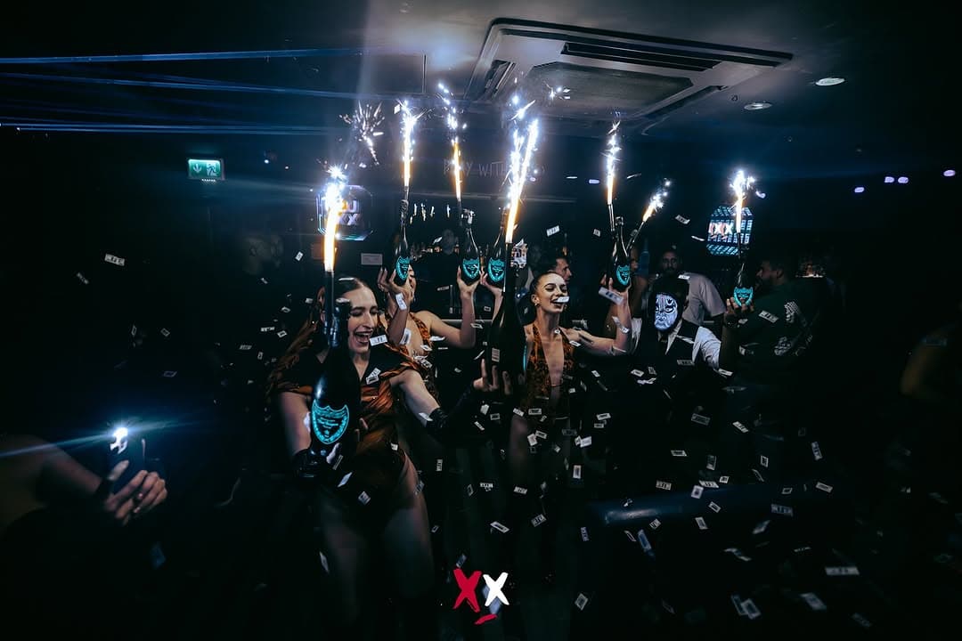 Luxx Club London Halloween party 2025 with dramatic lighting and costumed guests