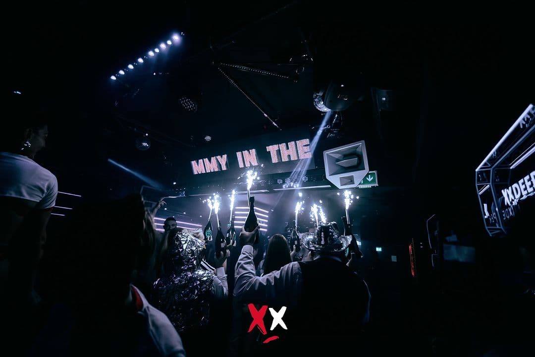 Luxx Club tables and stage with performers