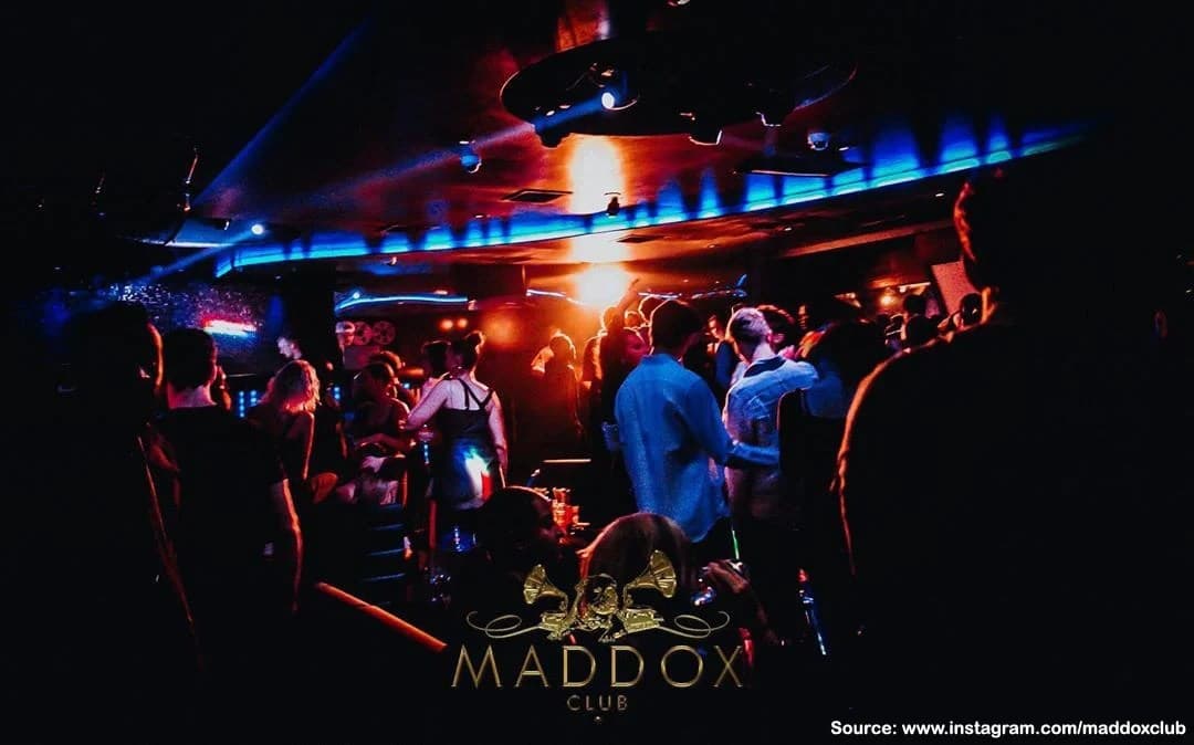 Maddox nightclub table client posing for a photo